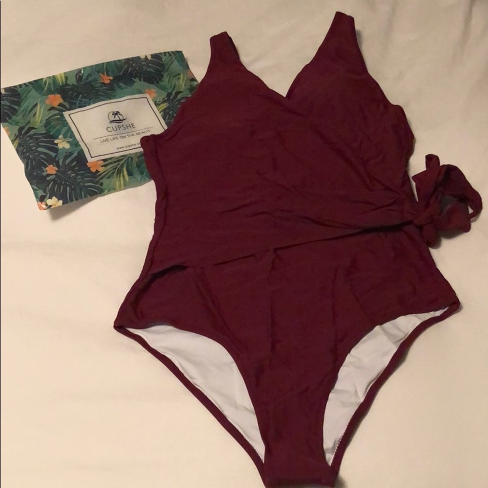 Red one-piece bathing suit with wrap-around tie.